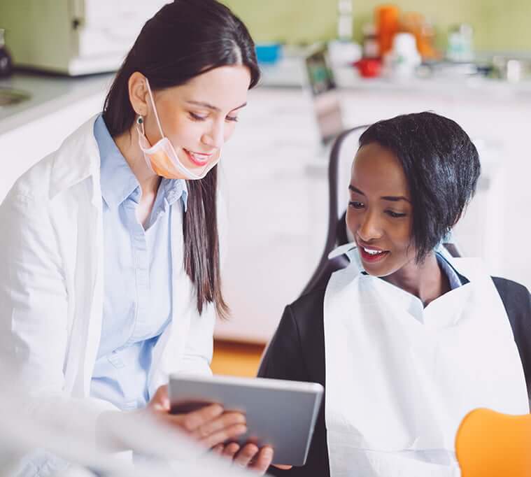 dentist talking with a patient