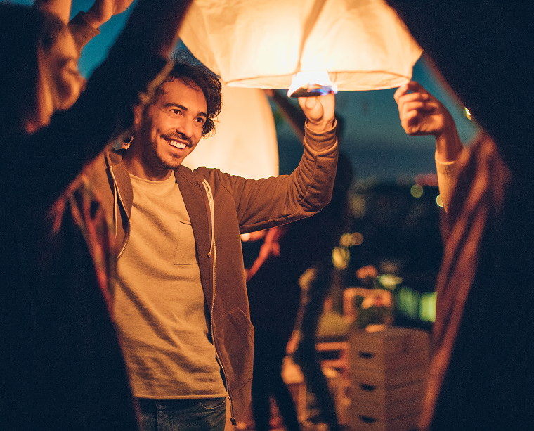 man releasing lantern