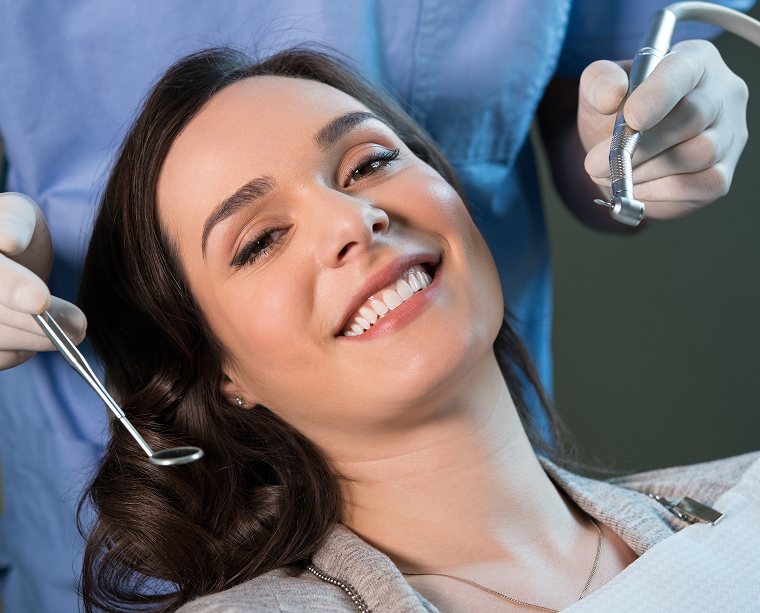 woman smiling at the dentist