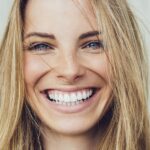 woman wondering how long professional teeth whitening lasts